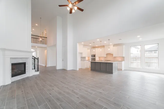 a view of a kitchen with a sink and a stove top oven
