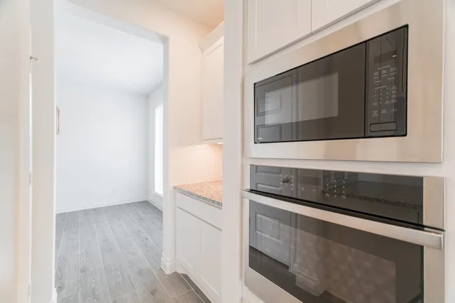 a kitchen with a stove and a microwave