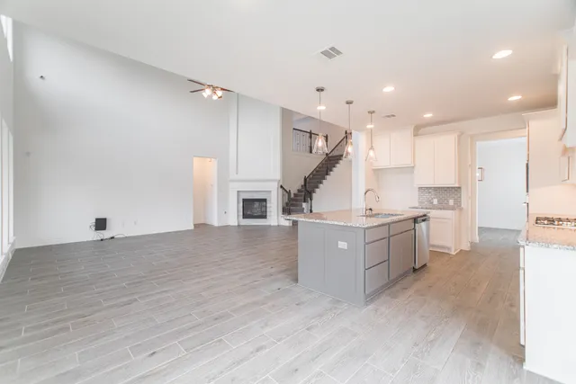 a view of kitchen with cabinets and wooden floor