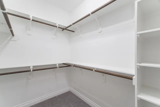 a view of an empty walk in closet