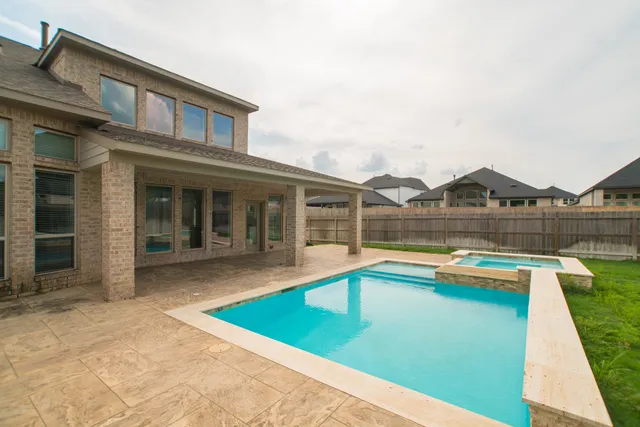 a view of pool with outdoor seating