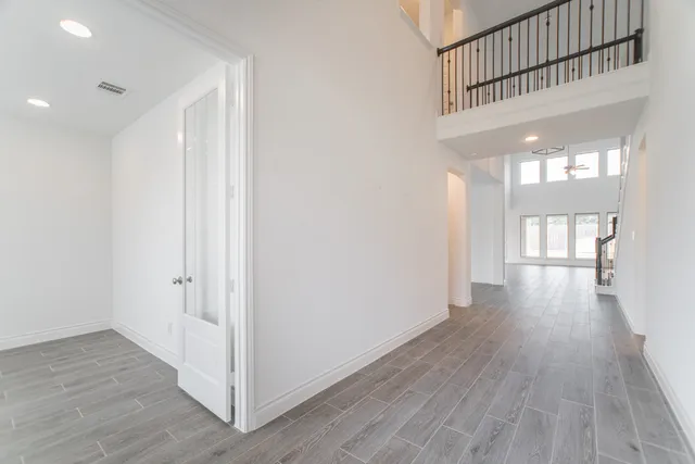 a view of gallery with wooden floor