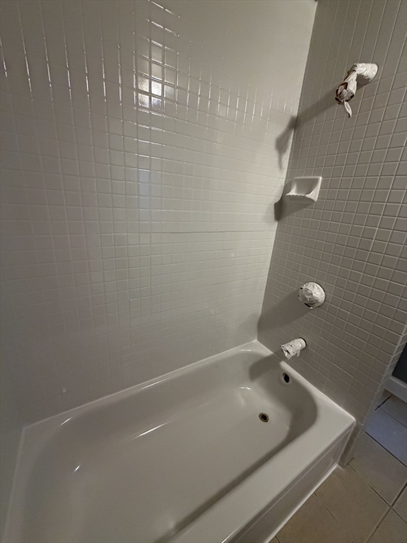 159 Grandview Avenue, Unit 1 Quincy, MA 02170 - Photo 7 of 10 a bathroom with a tub and shower