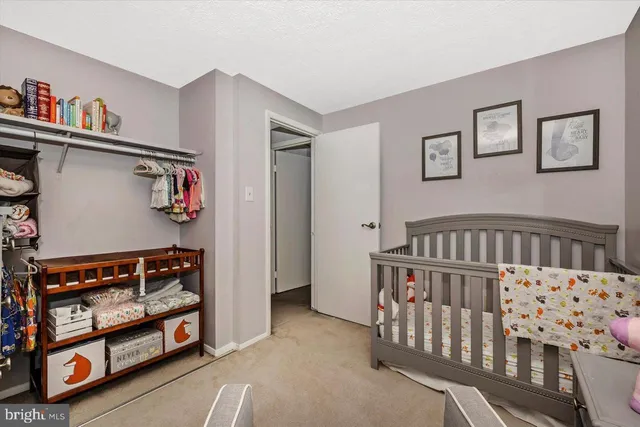 a living room with furniture and gym equipment
