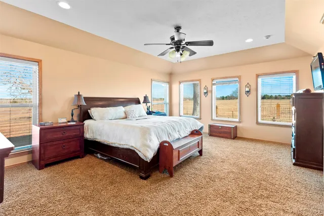 a bedroom with two beds and a window