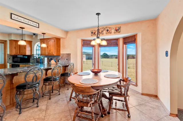 a view of a livingroom with a ceiling fan and window