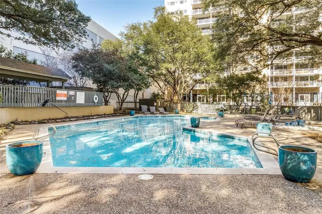 a view of a swimming pool with a patio
