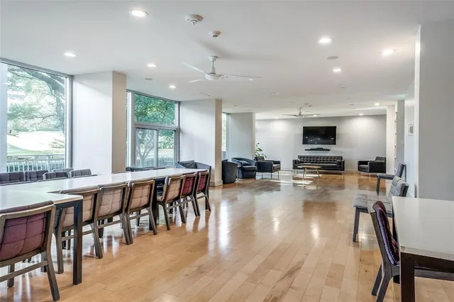 a large kitchen with lots of table and chairs
