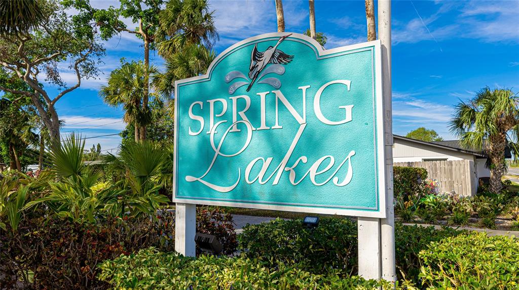 527 Spring Lakes Boulevard Bradenton, FL 34210 - Photo 32 of 41 a sign that is on a pole on a wall