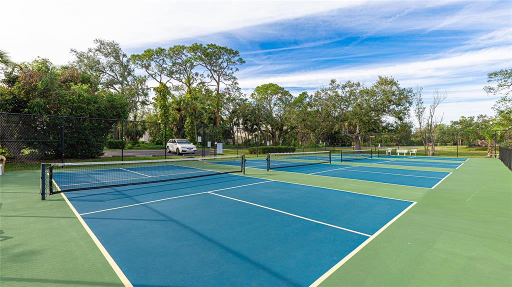 527 Spring Lakes Boulevard Bradenton, FL 34210 - Photo 40 of 41 a view of an outdoor space and tennis court