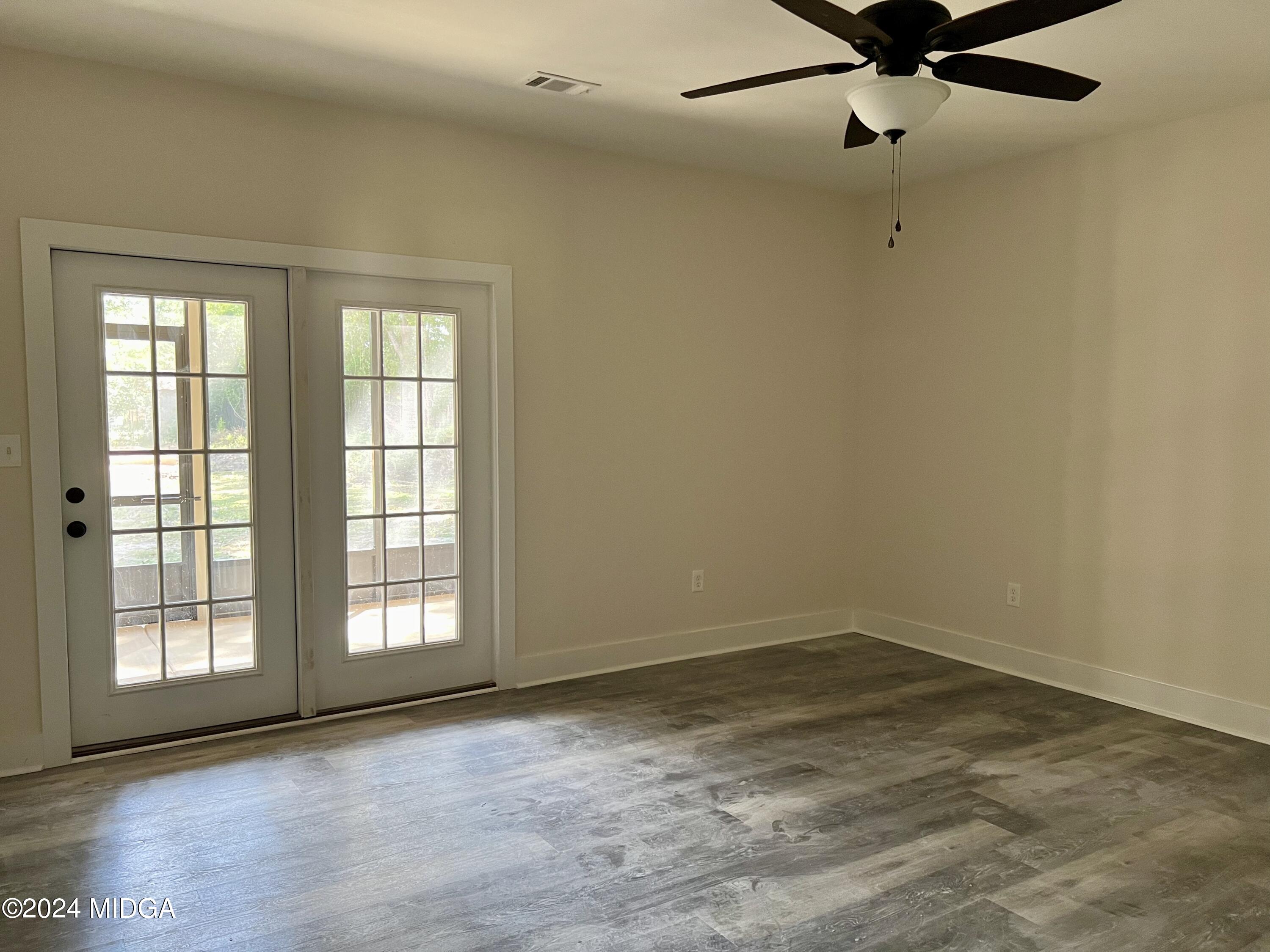 450 Walker Road Byron, GA 31008 - Photo 16 of 22 a view of an empty room with a window