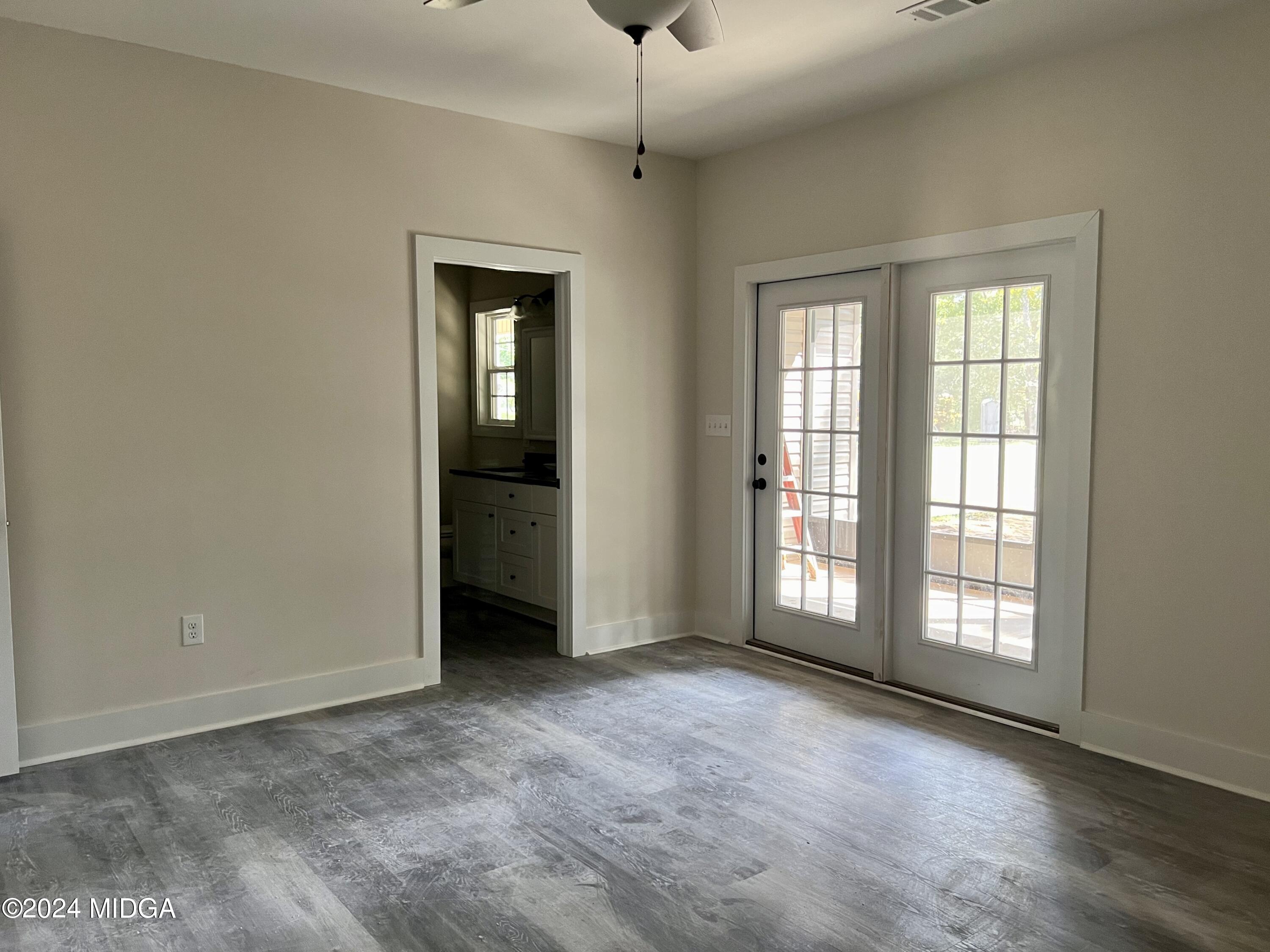 450 Walker Road Byron, GA 31008 - Photo 17 of 22 a view of an empty room with a window
