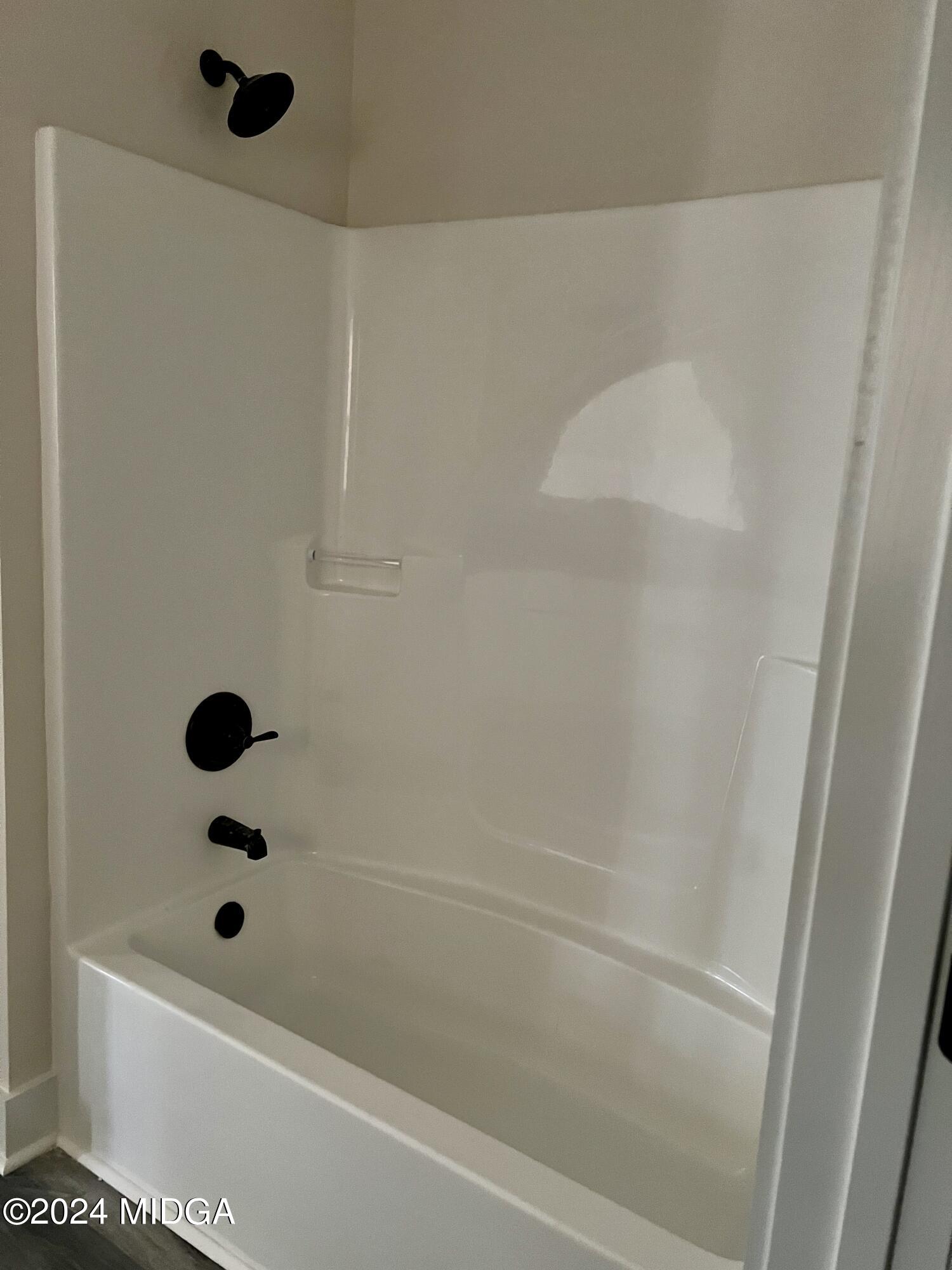 450 Walker Road Byron, GA 31008 - Photo 19 of 22 a bathroom with a shower