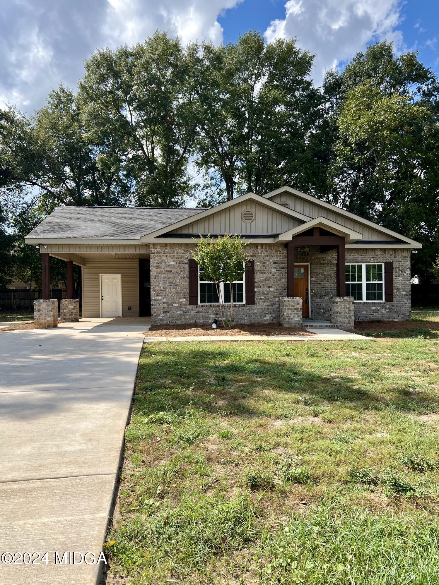 450 Walker Road Byron, GA 31008 - Photo 21 of 22 a front view of a house with a garden