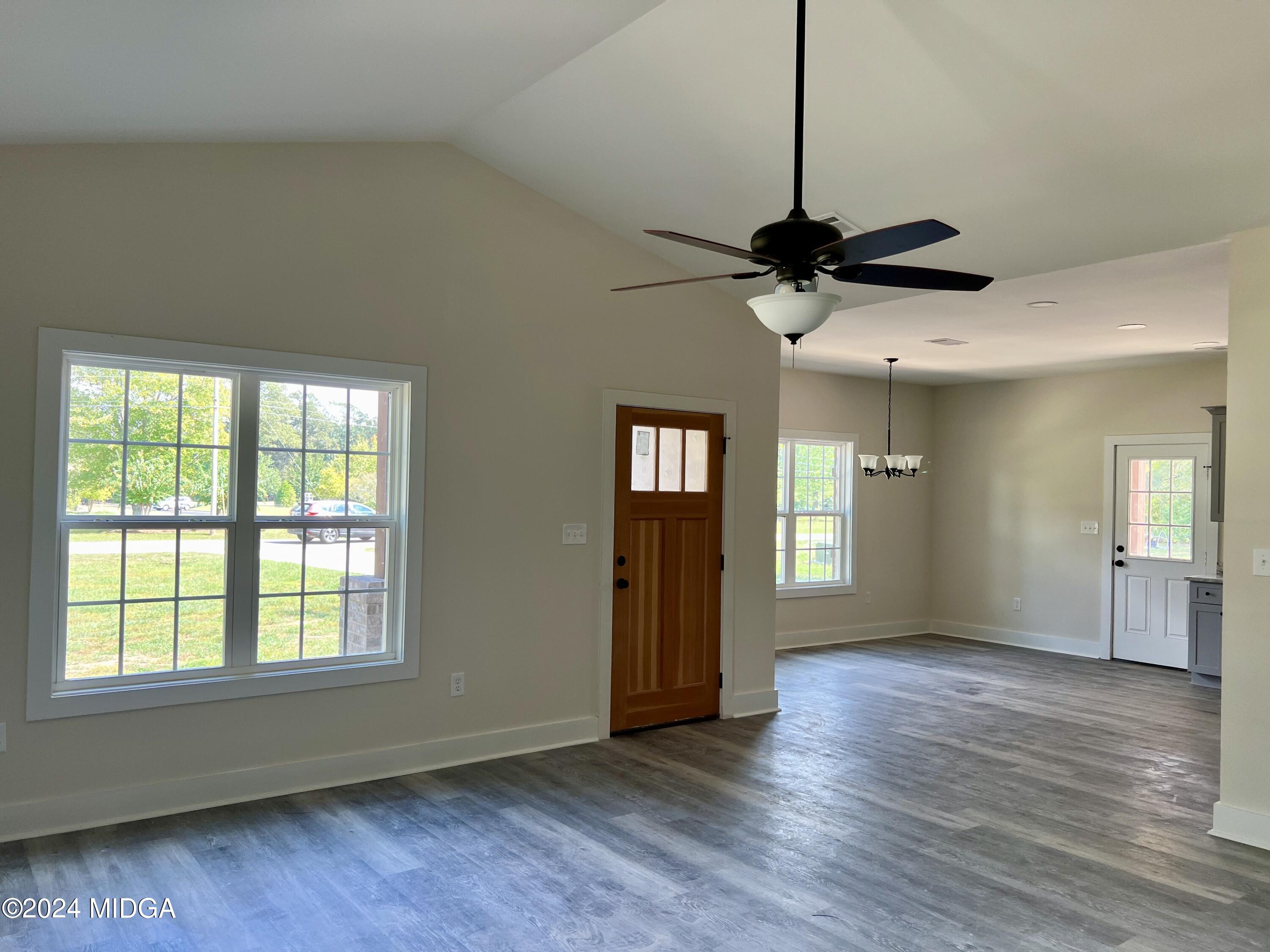 450 Walker Road Byron, GA 31008 - Photo 8 of 22 a view of an empty room with window and wooden floor