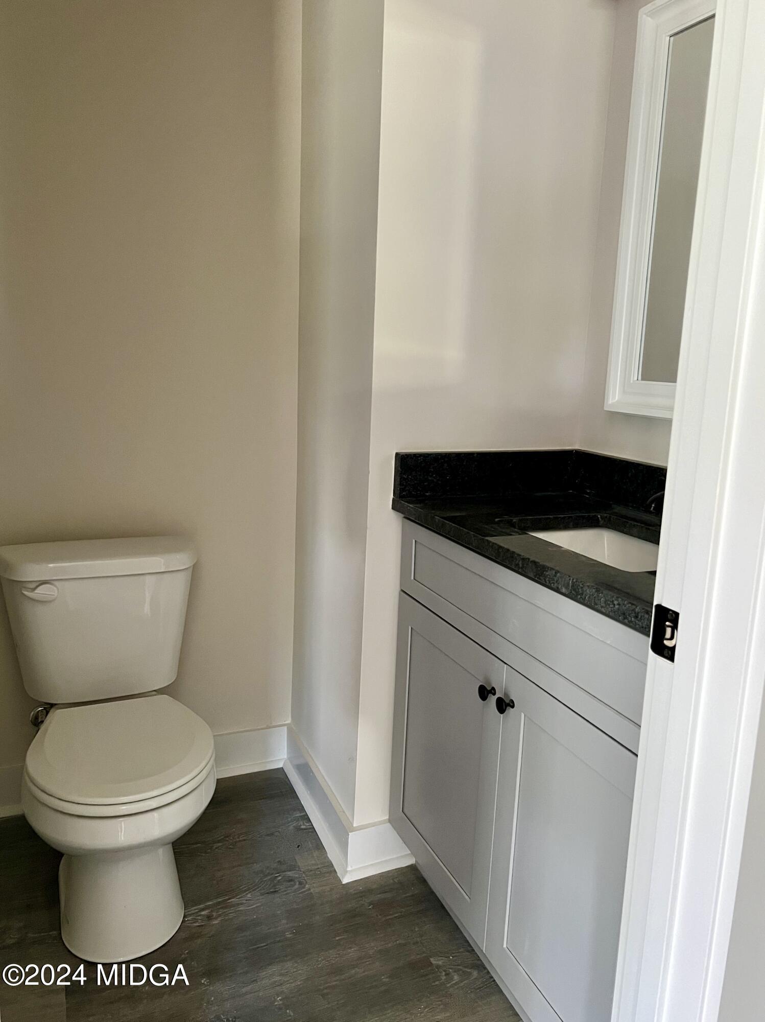 450 Walker Road Byron, GA 31008 - Photo 10 of 22 a bathroom with a toilet and a sink