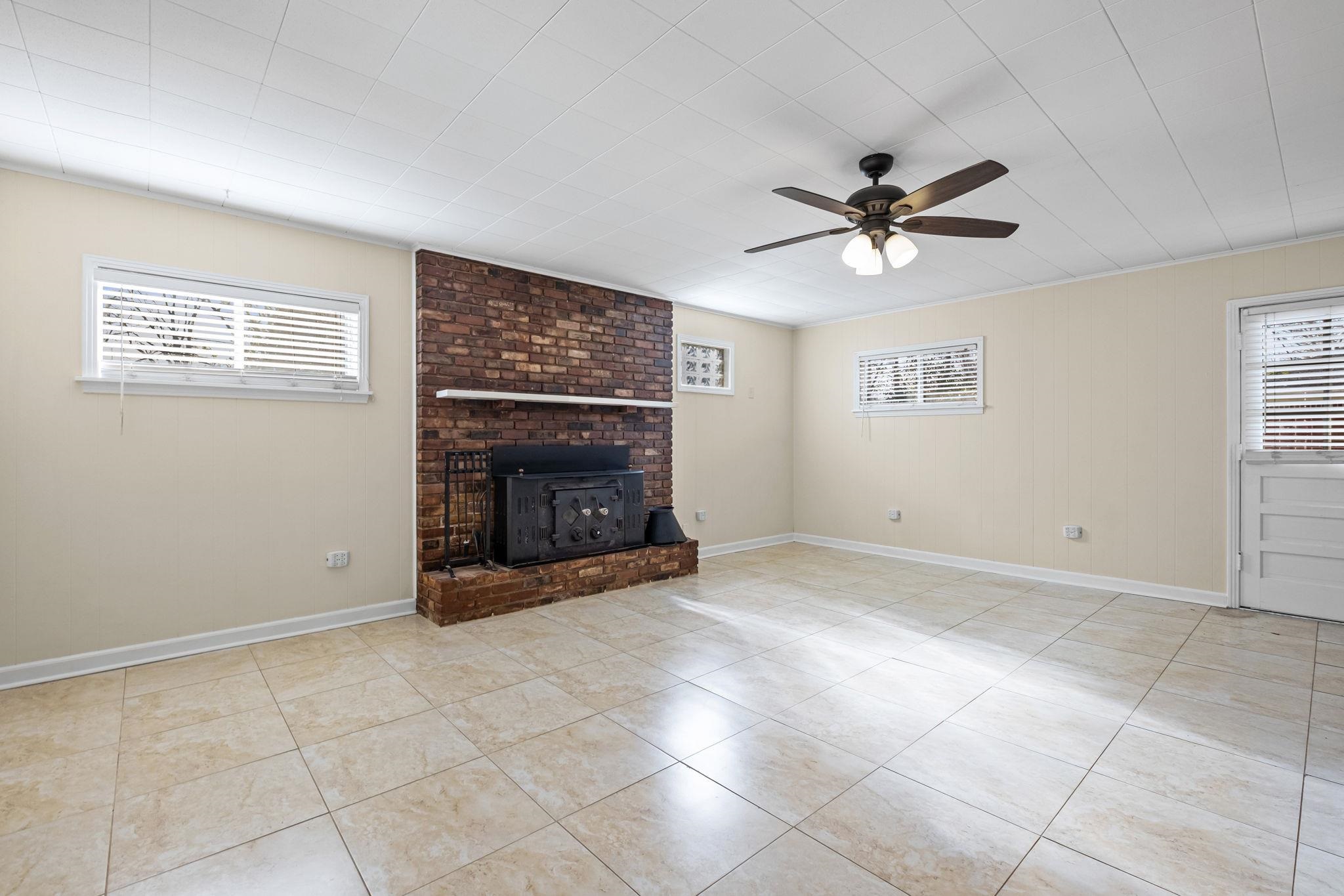 5037 Dee Road Memphis, TN 38117 - Photo 11 of 29 a view of an empty room with a fireplace
