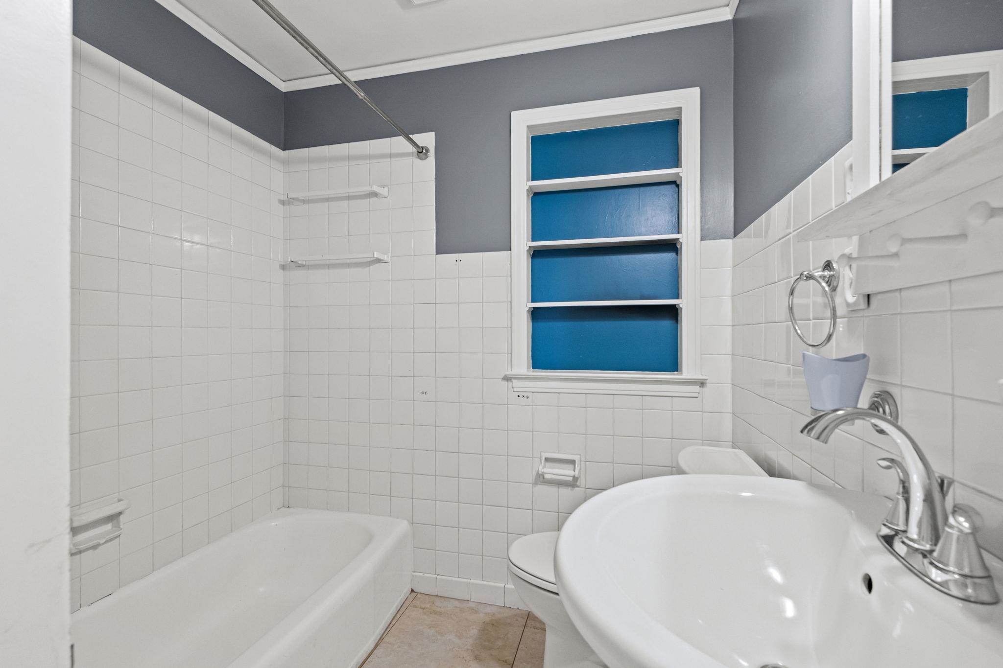 5037 Dee Road Memphis, TN 38117 - Photo 17 of 28 a bathroom with a sink a toilet and shower