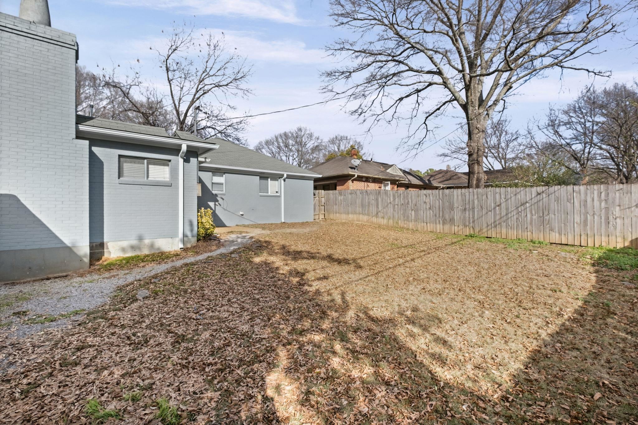 5037 Dee Road Memphis, TN 38117 - Photo 25 of 28 a view of a house with a yard covered with snow