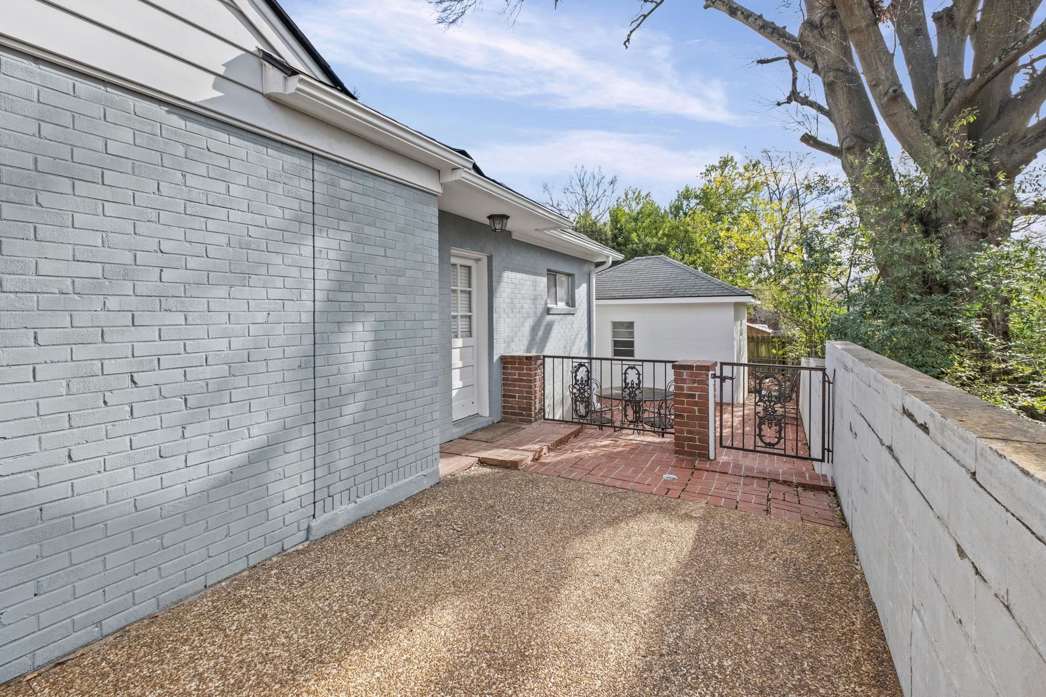 5037 Dee Road Memphis, TN 38117 - Photo 4 of 28 a front view of a house with a yard and garage