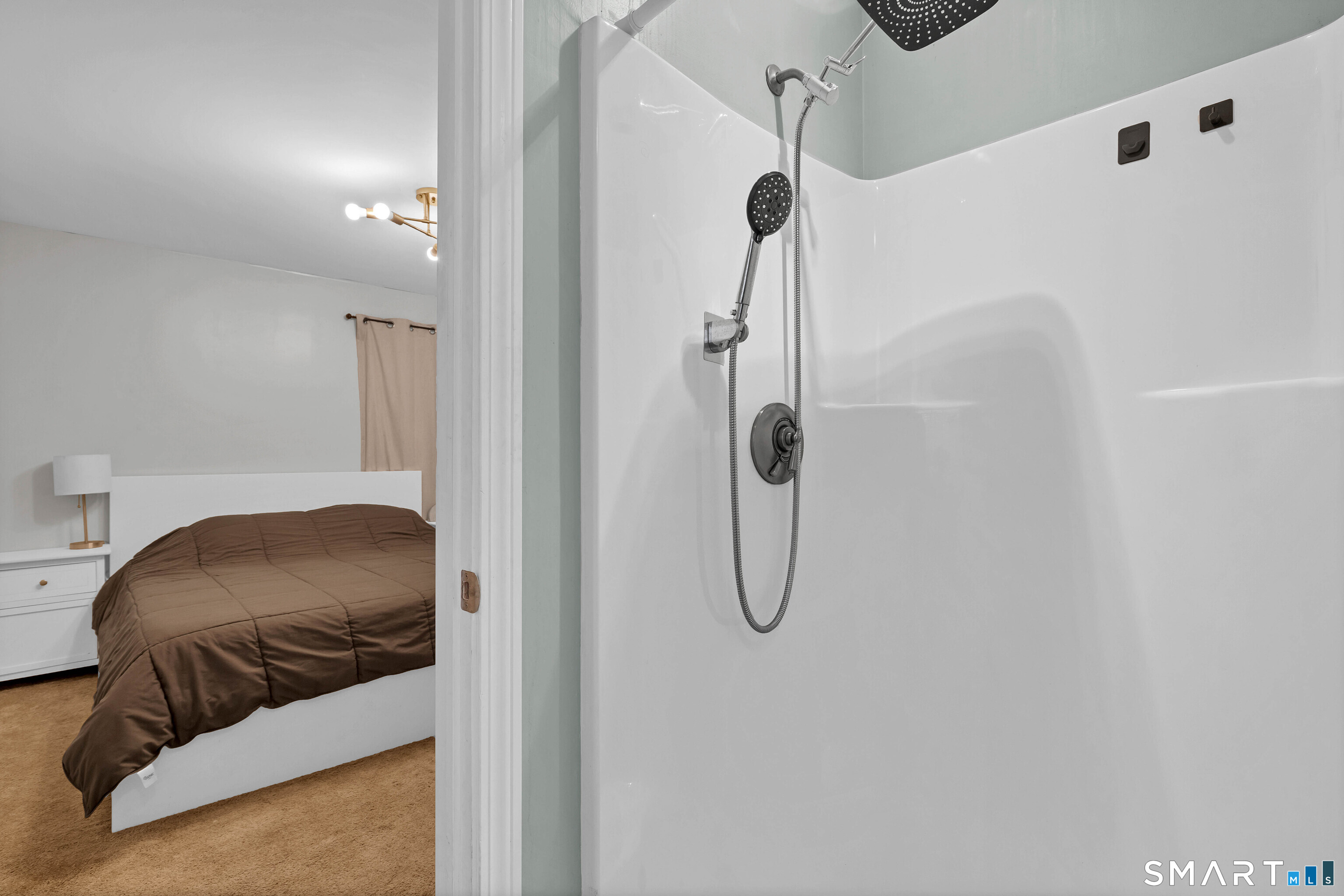 15 Country Club Drive Ledyard, CT 06339 - Photo 22 of 40 a bedroom with a bed and a shower