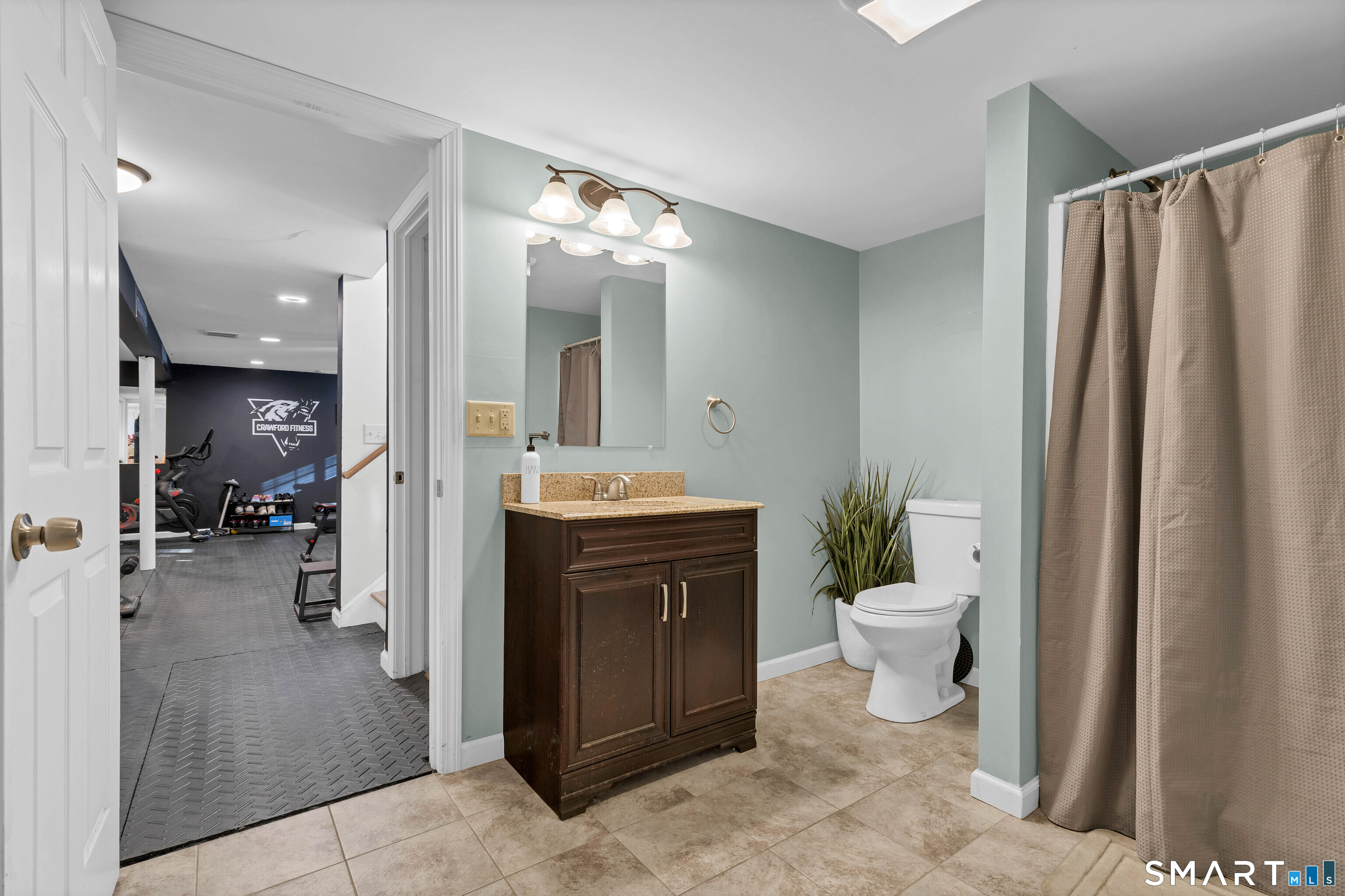 15 Country Club Drive Ledyard, CT 06339 - Photo 36 of 40 a bathroom with a toilet sink and mirror