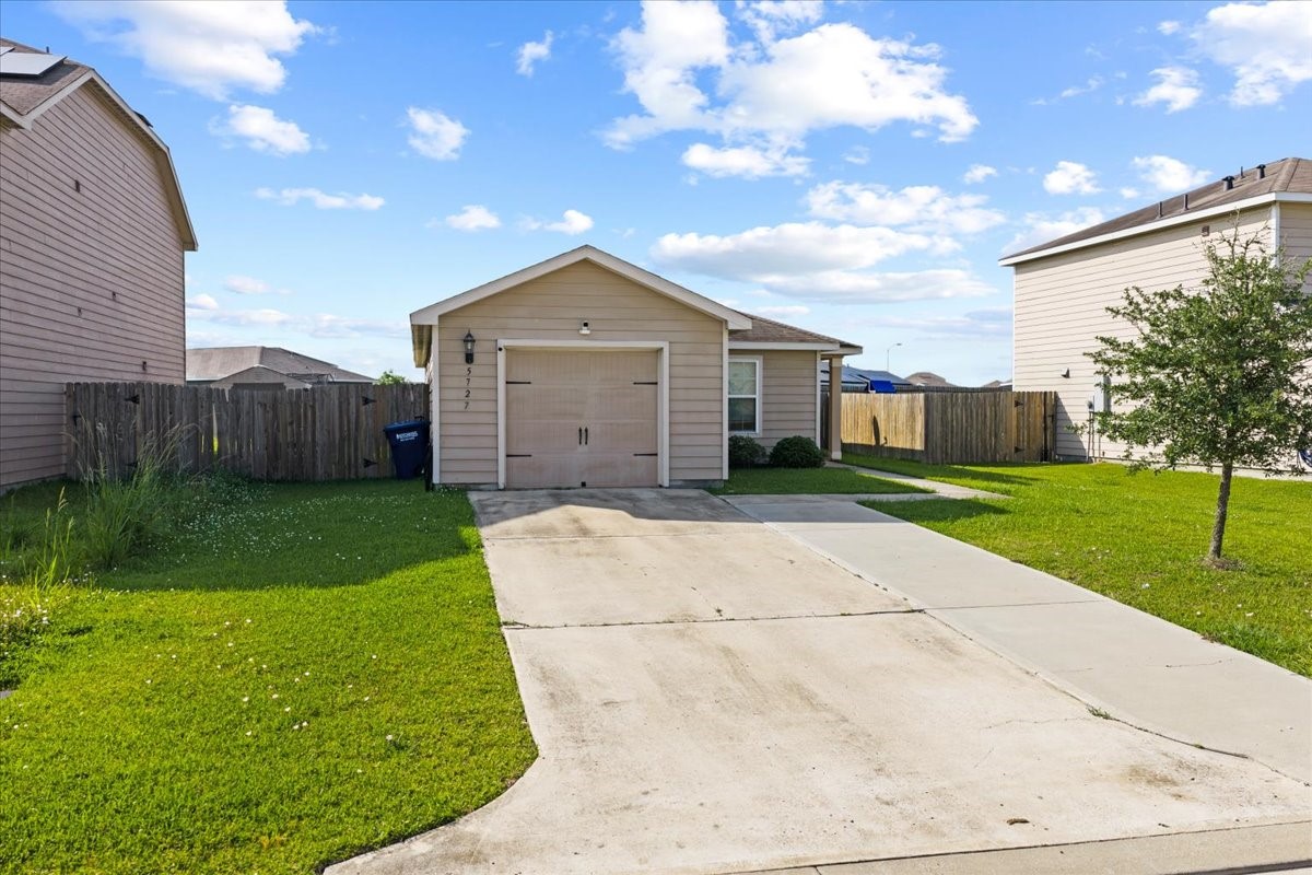 5727 Treasure Cove Road Cove, TX 77523 - Photo 16 of 20 a view of a house with a yard