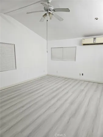 a view of room with window and ceiling fan