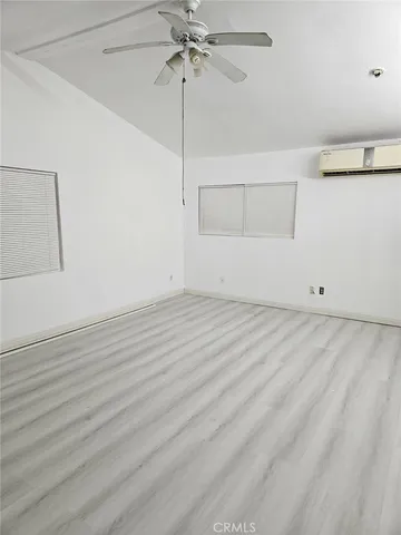 a view of room with window and ceiling fan