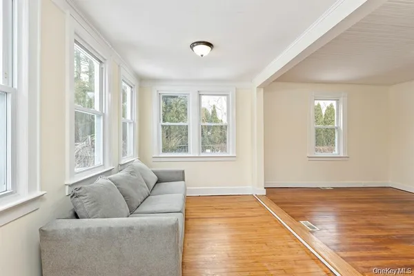 a living room with furniture and windows
