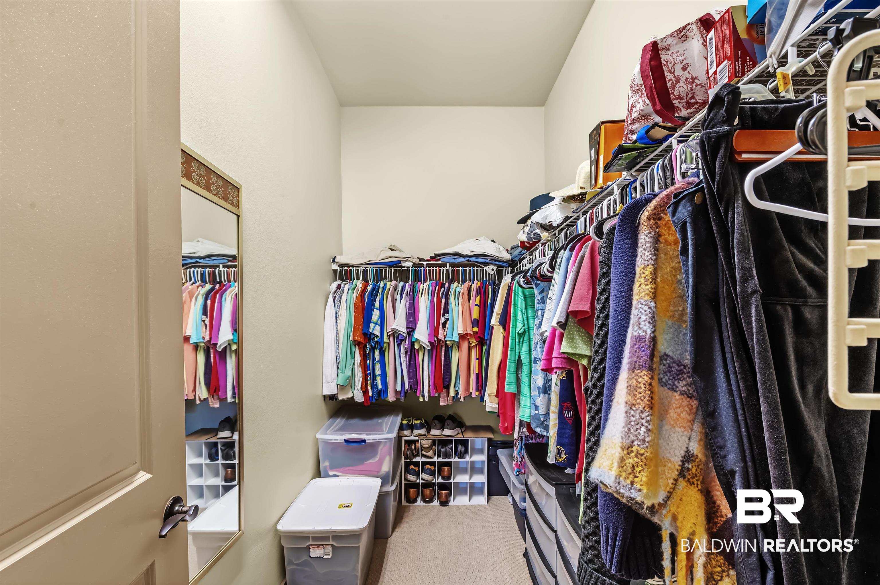 1430 Regency Road, Unit A301 Gulf Shores, AL 36542 - Photo 24 of 47 Walk in closet with carpet floors