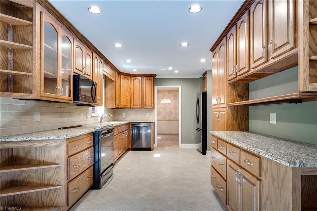 607 Hobbs Road Greensboro, NC 27403 - Photo 8 of 29 INCREDIBLE FULL WOOD 42" maple cabinets with granite counters, RECESSED LIGHTING, and updated appliances. These cabinets could be sanded and painted and are easily higher quality than 90% of what's produced today. They are in terrific condition.