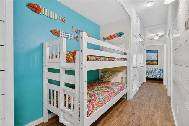 a bedroom with furniture and baby crib