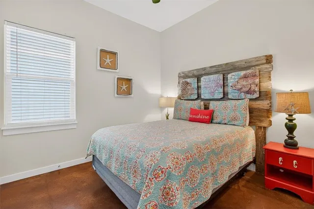 a bedroom with bed and window