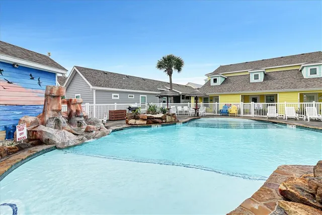 a view of a house with swimming pool and porch