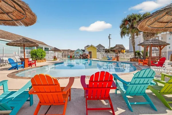 a view of a backyard with sitting area and outdoor kitchen