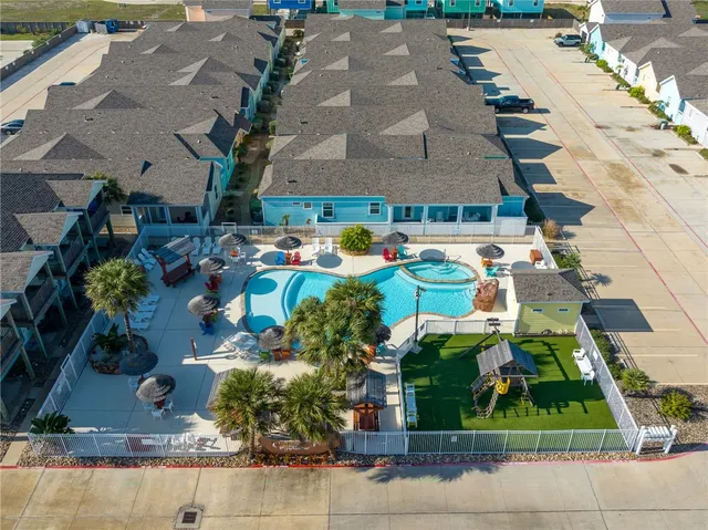 a view of a backyard with sitting area and outdoor kitchen