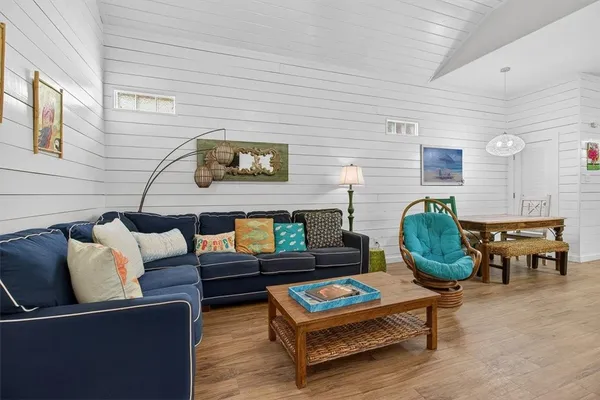 a kitchen with stainless steel appliances granite countertop a sink a refrigerator and a stove
