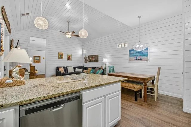 a kitchen with a counter space cabinets and appliances