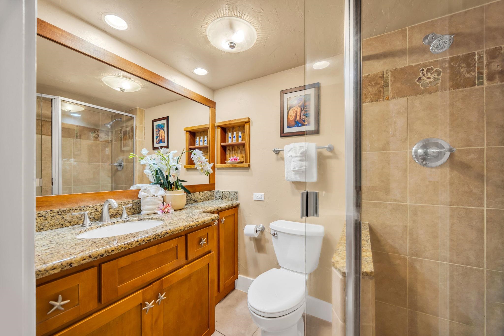3615 Lower Honoapiilani Road, Unit 222 Lahaina, HI 96761 - Photo 12 of 50 a bathroom with a granite countertop sink toilet and shower