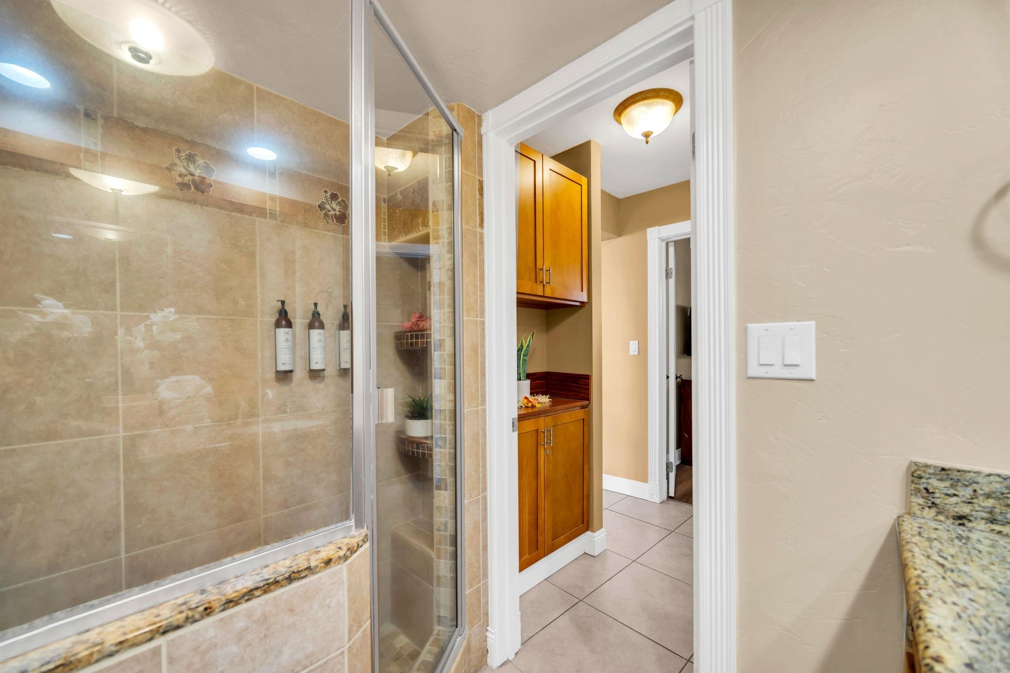 3615 Lower Honoapiilani Road, Unit 222 Lahaina, HI 96761 - Photo 13 of 50 a bathroom with a mirror and a shower