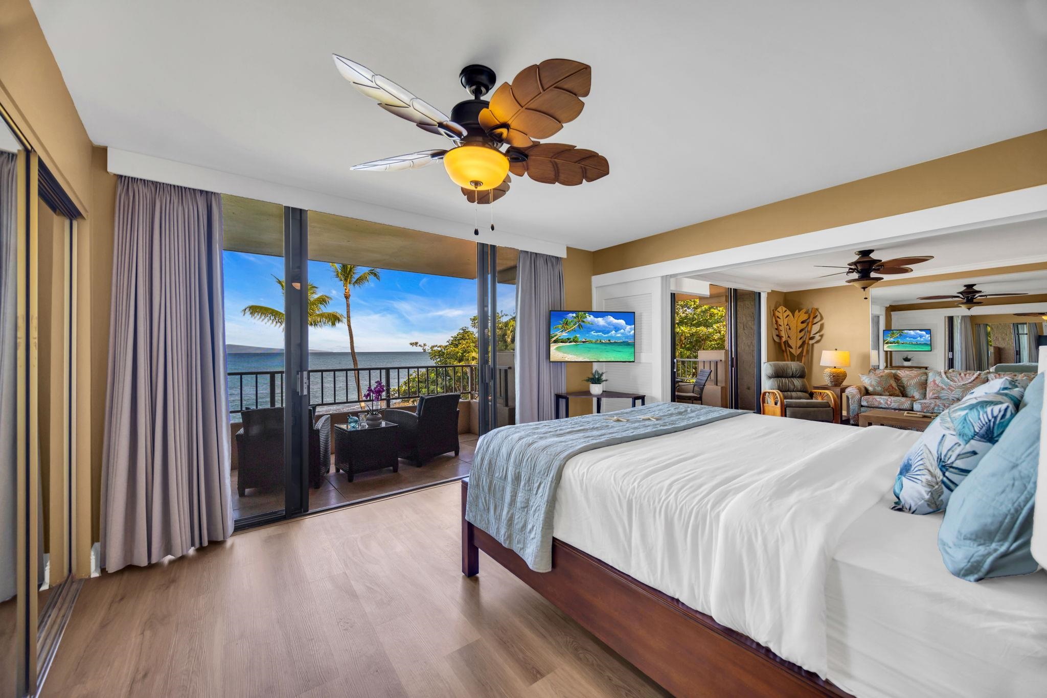 3615 Lower Honoapiilani Road, Unit 222 Lahaina, HI 96761 - Photo 18 of 50 a bedroom with a bed dresser and a large window