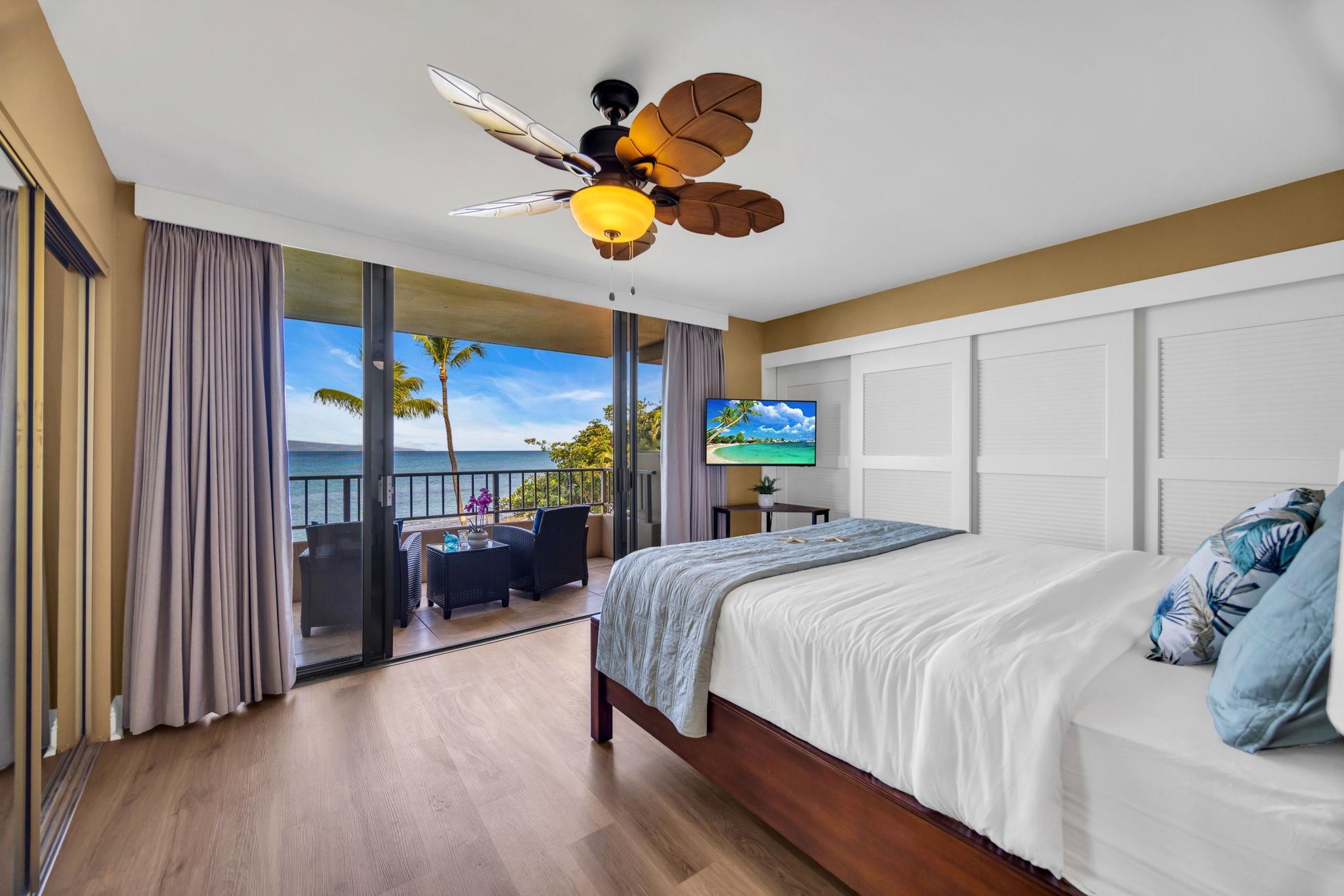 3615 Lower Honoapiilani Road, Unit 222 Lahaina, HI 96761 - Photo 19 of 50 a bedroom with a bed mirror and a large window