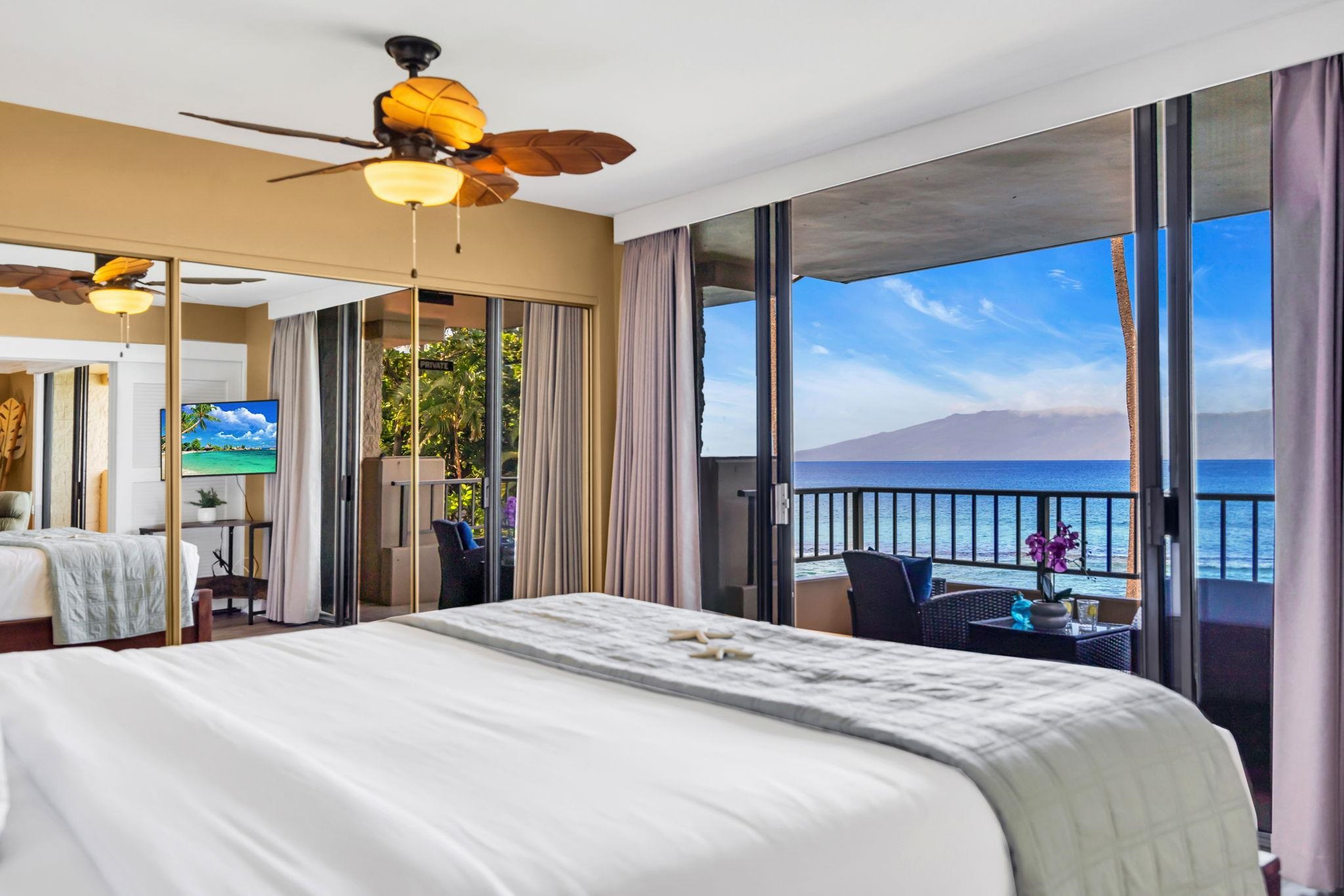 3615 Lower Honoapiilani Road, Unit 222 Lahaina, HI 96761 - Photo 2 of 50 a bedroom with a large bed and a large window