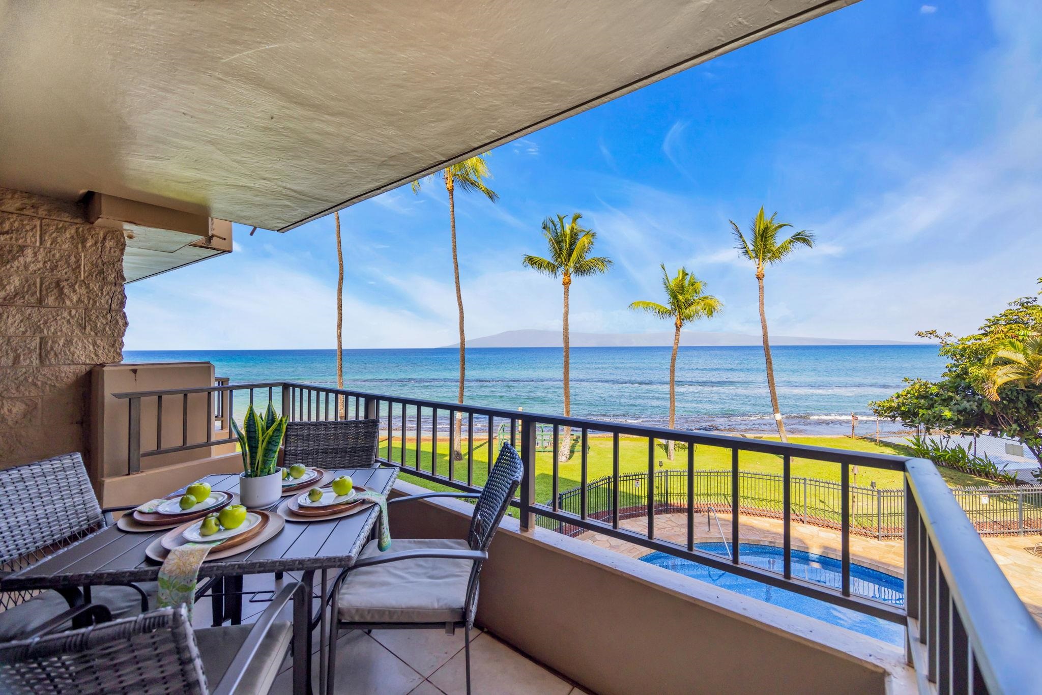 3615 Lower Honoapiilani Road, Unit 222 Lahaina, HI 96761 - Photo 33 of 50 a view of a balcony dining area with swimming pool