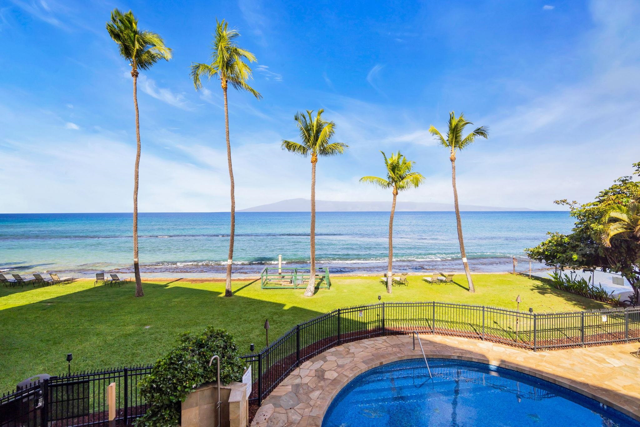 3615 Lower Honoapiilani Road, Unit 222 Lahaina, HI 96761 - Photo 37 of 50 a view of a swimming pool with a lounge chairs