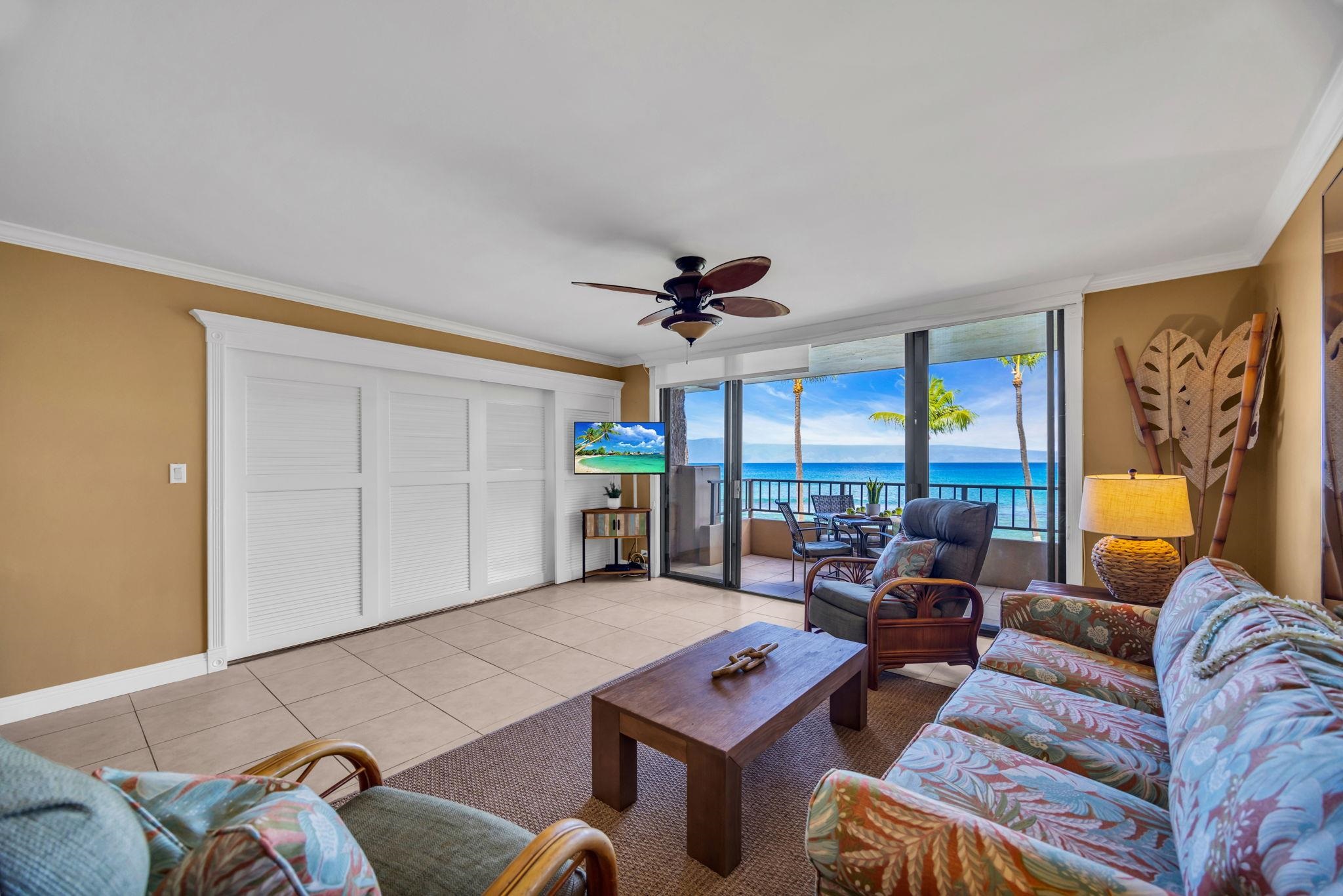 3615 Lower Honoapiilani Road, Unit 222 Lahaina, HI 96761 - Photo 41 of 50 a living room with furniture a ceiling fan and a rug