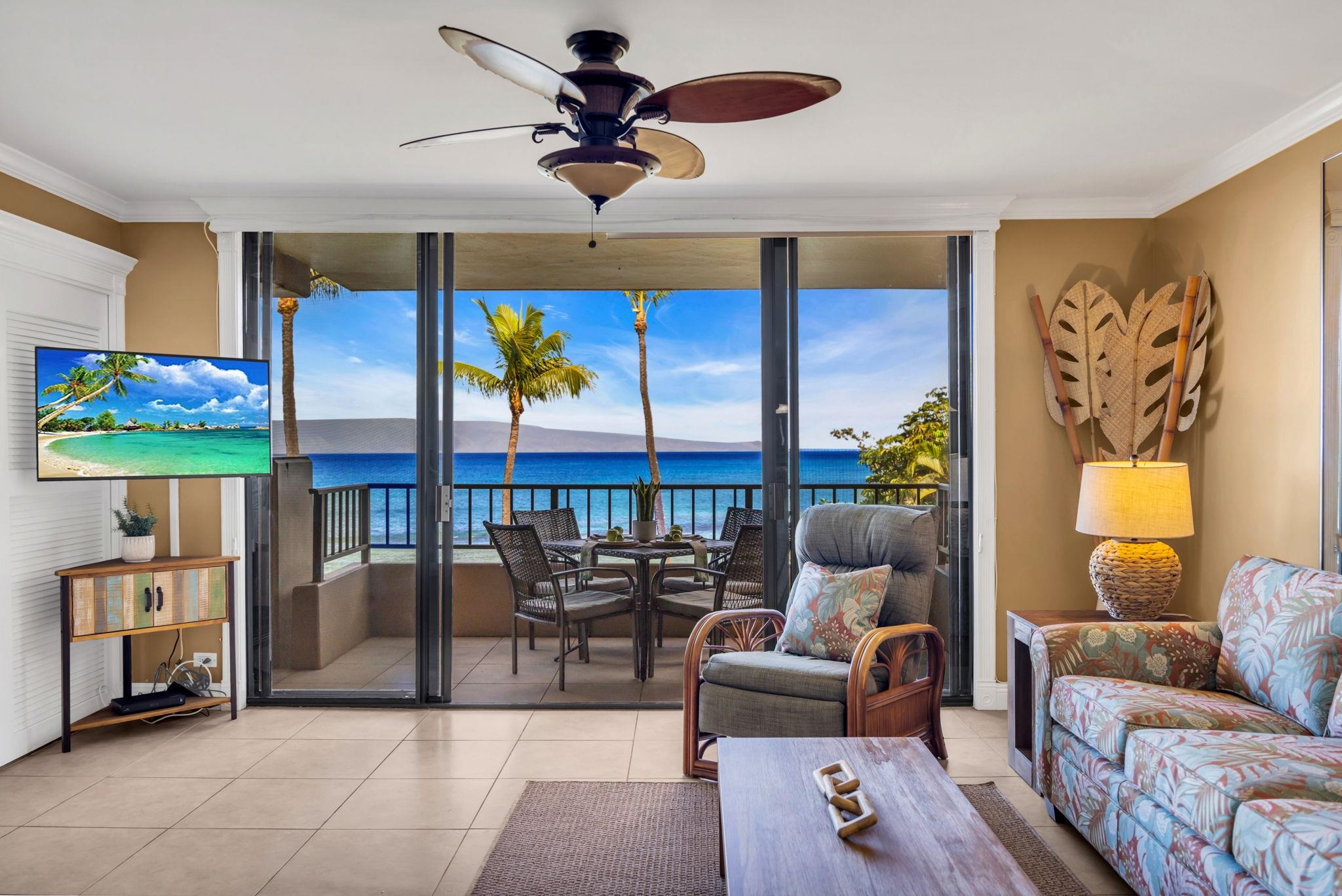 3615 Lower Honoapiilani Road, Unit 222 Lahaina, HI 96761 - Photo 43 of 50 a living room with furniture and a floor to ceiling window