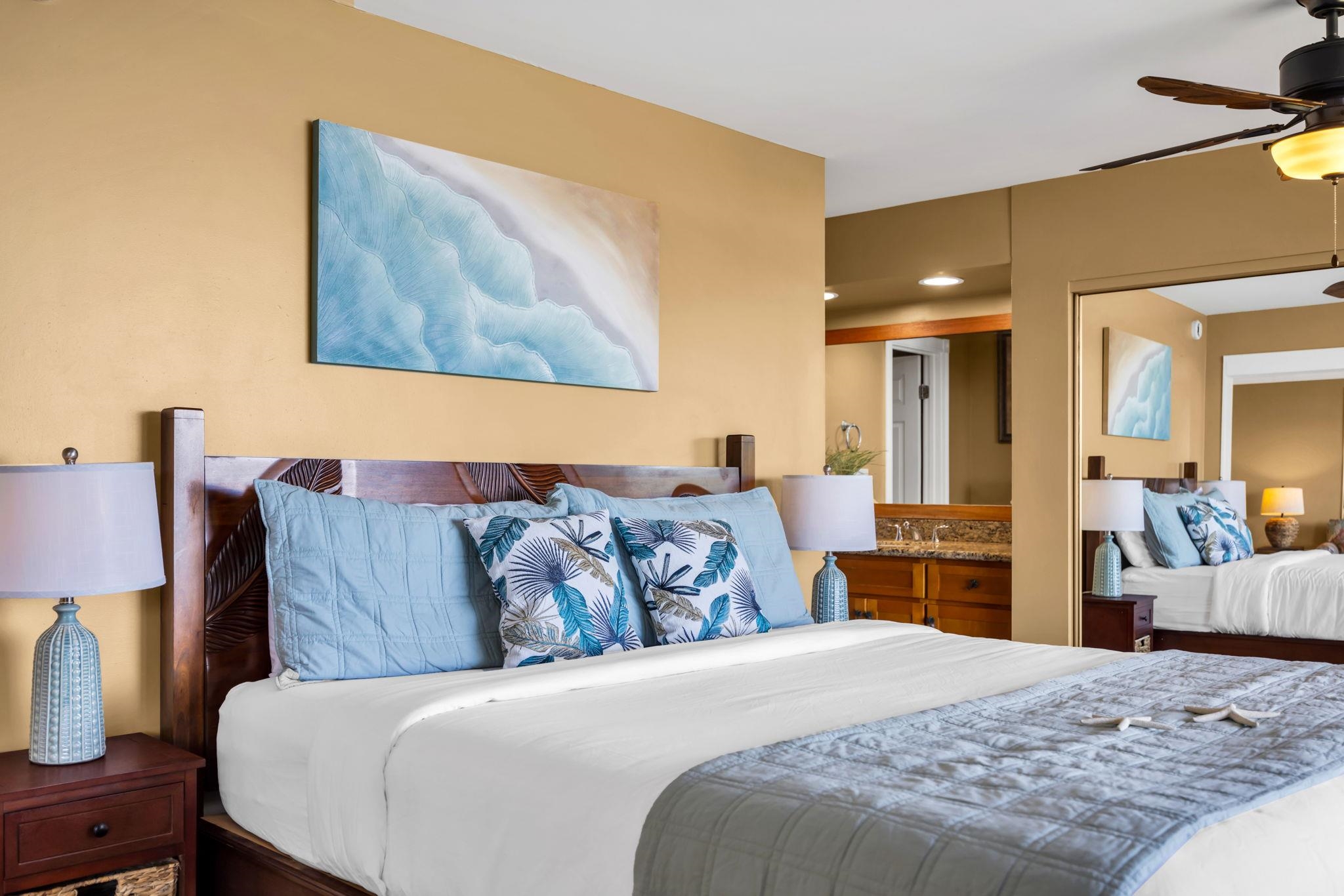 3615 Lower Honoapiilani Road, Unit 222 Lahaina, HI 96761 - Photo 47 of 50 a bedroom with a bed and wooden floor