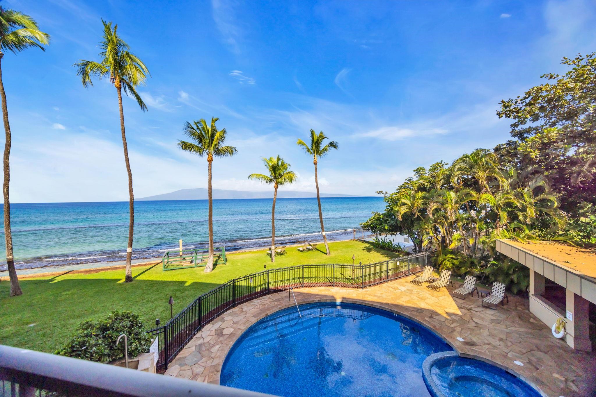 3615 Lower Honoapiilani Road, Unit 222 Lahaina, HI 96761 - Photo 5 of 50 a view of a swimming pool with a lounge chair